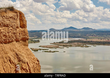 Red clay erosion gully and river. Eroded landscape. Toledo, Spain Stock Photo