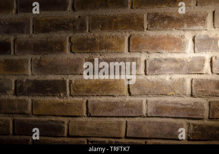 blank brick wall under spot light Stock Photo