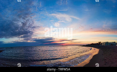 Panoramic blue sunset on Roman coast at Ostia Lido, with the intense sky the calm sea and a relaxing atmosphere Stock Photo