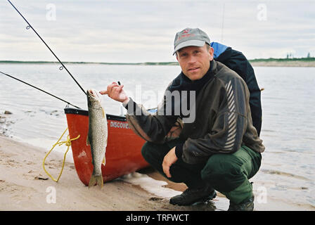The Norwegian Truls Andersen with a lake trout, Salvelinus namaycush, caught on a canoe trip on the Thelon River in the Northwest Territories, Canada. July, 2001. Stock Photo