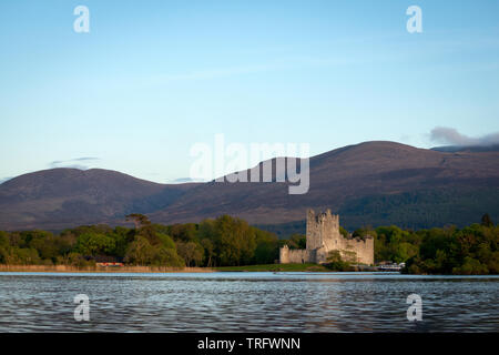 Ross Castle, Killarney, Ireland classic view at the shore of Lough Leane in Killarney National Park on a beautiful evening with soft glowing light. Stock Photo