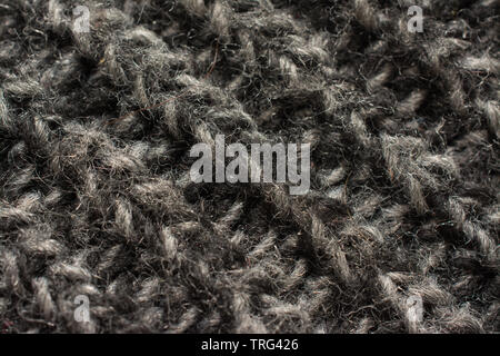 highly detailed needlework wool fabric, close up wool texture background Stock Photo