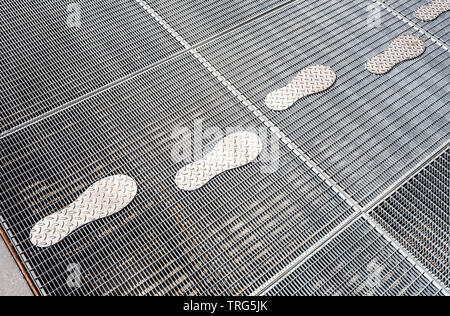 Stylized traces on the metal lattice as background Stock Photo