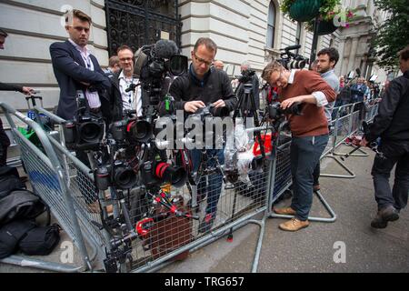 Photographers set up remote control cameras opposite the door to number 10 ahead of the arrival of the President on Downing Street, Westminster, Londo Stock Photo