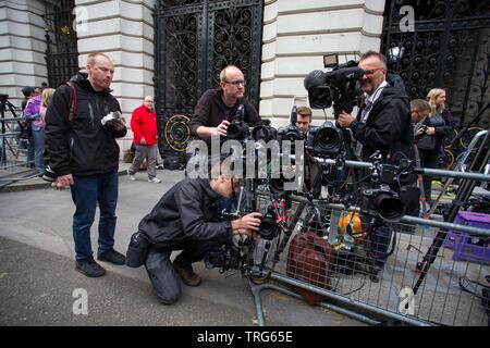 Photographers set up remote control cameras opposite the door to number 10 ahead of the arrival of the President on Downing Street, Westminster, Londo Stock Photo