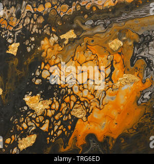photography of abstract marbleized effect background. yellow and black creative colors. Beautiful paint with the addition of gold Stock Photo