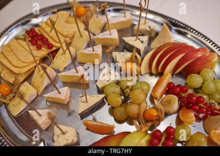 cheese plate; food; cheese; fruits; served; cafe; restaurant; party; tray; buffet; buffet table Stock Photo