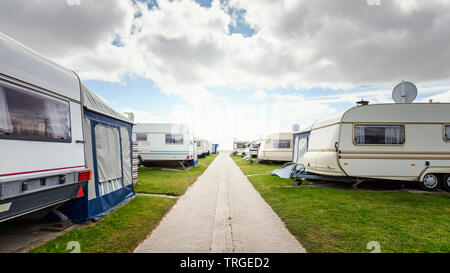 Caravan camping on the beach. Family vacation in caravan park. North sea coast, Germany Stock Photo