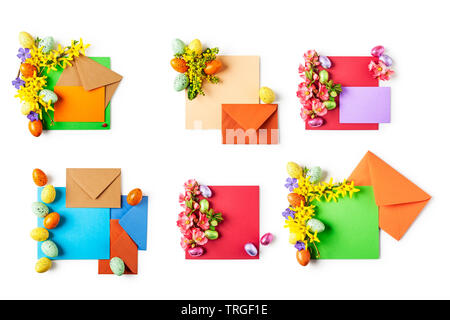 Easter greeting card with flowers, eggs, note paper and envelopes collection. Holiday composition isolated on white background. Spring arrangement and Stock Photo