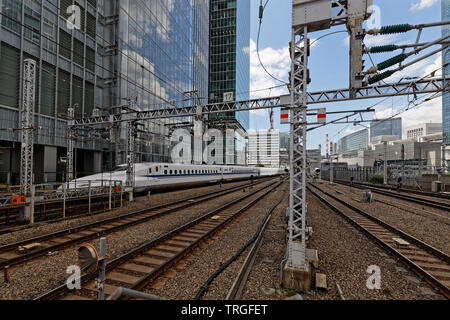 TOKYO, JAPAN, May 16, 2019 : White train enters the station. Shinkansen is a network of high-speed railway lines in Japan, also known in English as th Stock Photo