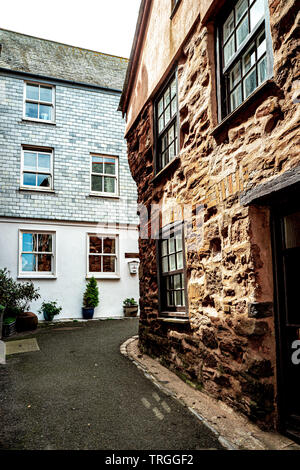 Red stone Cornish cottage, Kingsand, Cornwall Stock Photo