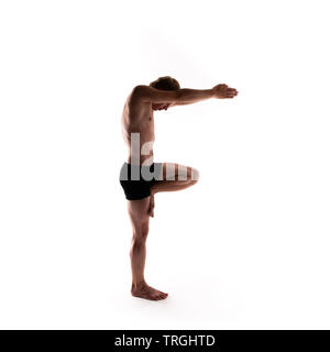 Yoga alphabet. The letter F formed by gymnast body Stock Photo