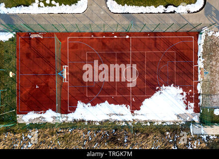 Top graphic view of basketball, volleyball or football court field red background, drone photography. Stock Photo