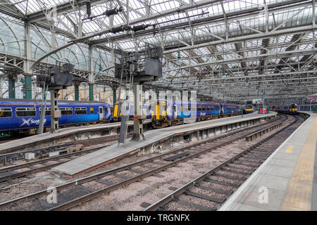 Inside Glasgow Central Station showing a selection of blue Scotrail trains Stock Photo