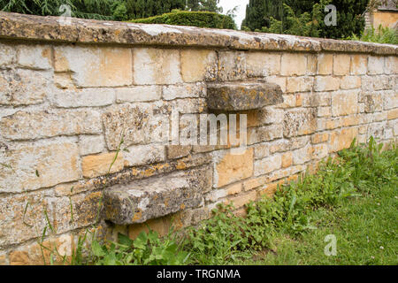 Stone steps inseted into a cotswold wall, the Cotswolds, England, UK Stock Photo