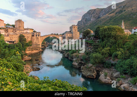 Evening scene in Mostar with the medieval town and the historic bridge over the Neretva river in Bosnia Herzegovina. Stock Photo