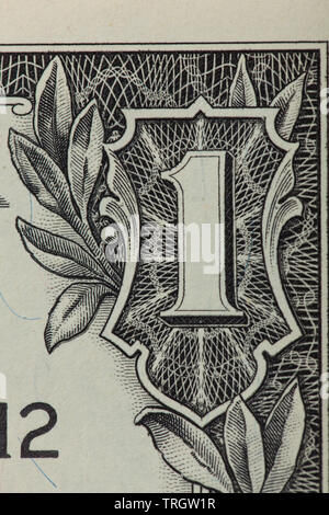 Front of a 1 dollar bill with focus on the 1 in the corner Stock Photo