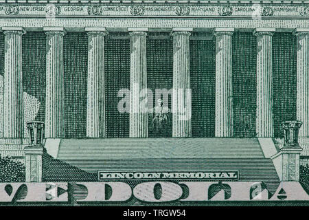 Back of a five dollar bill with focus on the Lincoln Memorial Stock Photo