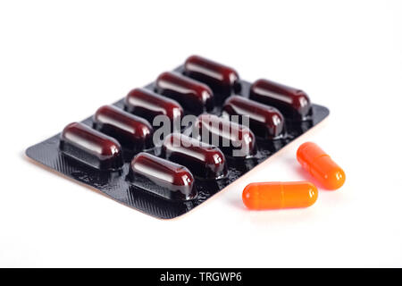 Vitamin C capsule on white background Stock Photo