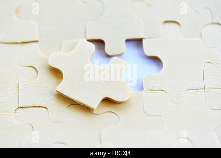 Jigsaw puzzle on white background top view / jigsaw piece connecting business solutions success and strategy concept Stock Photo