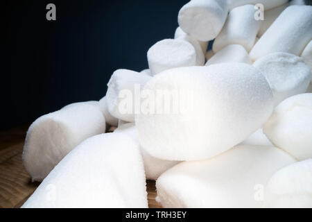 Pile of sweet and soft marshmallow. Yummy white sweets on dark background, fast food Stock Photo