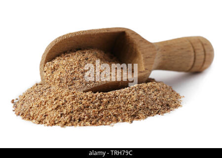 Ground carob (Ceratonia siliqua) powder in wooden scoop isolated on white background Stock Photo