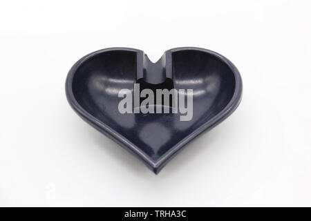 Heart shaped ashtray isolated on a white background, close-up Stock Photo