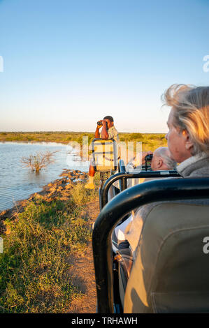 Tourists on safari at the Phinda Private Game Reserve, an andBeyond owned nature reserve in eastern South Africa. Stock Photo