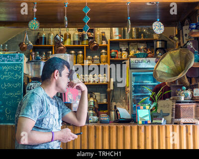 A man inside a traditional tea house in Esfahan, Iran. Stock Photo