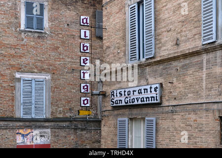 Hostel and restaurant in the university town of Urbino, province of Marche, Italy. Stock Photo