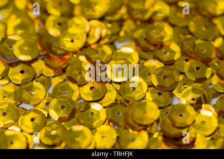 golden color sequins macro background Stock Photo