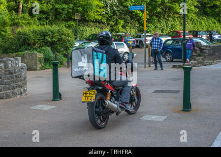 Deliveroo delivery driver for the online food ordering and delivery service. Seen in Bournemouth, UK. Stock Photo