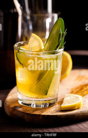 Fresh organic summer cocktails made with sour ginger craft beer or kombucha tea with cucumber and lemon on wooden background.Drink on the bar table Stock Photo