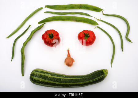 Organically grown garden vegetables in the shape of a face Stock Photo