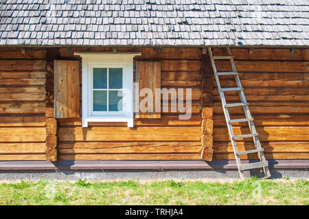 Old lithuanian wooden house in Vilnius, Lithuania with sky and nature Stock Photo