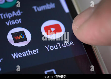 Youtube logo icon on mobile phone screen Stock Photo