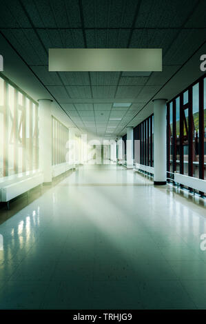 Empty Hospital Corridor with generic blank signage. Princess Royal Hospital, Haywards Heath, Sussex, England, UK Stock Photo