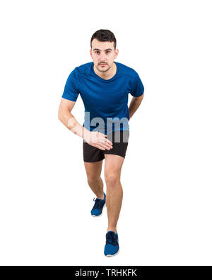 Determined caucasian man runner standing in running position looking ahead confident. Young guy sprinter wearing black and blue sport equipment. Stock Photo