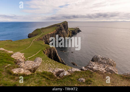 Neist point, famous rocky cliff head and iconic landmark on Isle of Skye, Scotland.Panoramic sea view.Scenic coastal landscape.Dramatic coastline. Stock Photo