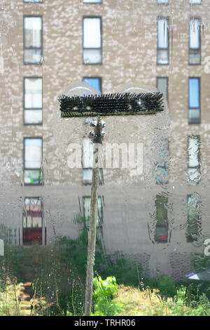 Window glass cleaning with pure water and extension pole. Washing and rinse using a reach and wash system. Stock Photo