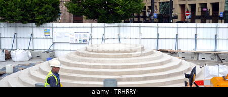 June 6, 2019. The site where a memorial to commemorate the Peterloo massacre of 1819 is being built in Manchester uk. The memorial will currently be a landscaped hill made out of concentric steps. On August 16, 1819, cavalry charged a crowd of some 60,000 people gathered on St Peter's Fields, Manchester, to demand the reform of parliamentary representation. Eighteen people were killed and hundreds injured. Stock Photo