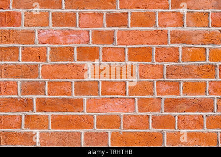 Red rough brick wall close up. Texture and background Stock Photo