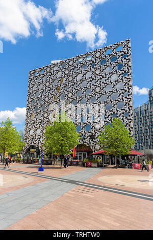 London, UK - May 1, 2018: Modern building with shops, bars and restaurants on Peninsula Square in front of the O2 Arena Stock Photo