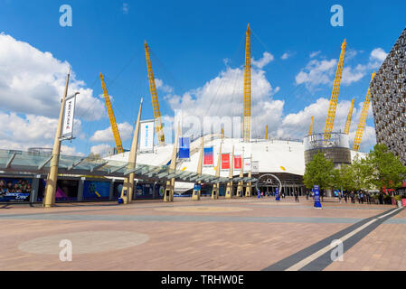 London, UK - May 1, 2018: People walk on Peninsula Square in front of the O2 Arena in North Greenwich Stock Photo