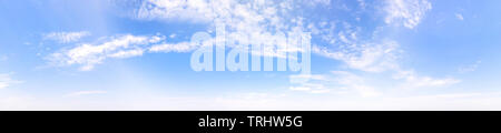 Bright blue cloudy sky at the horizon. Long panoramic view Stock Photo
