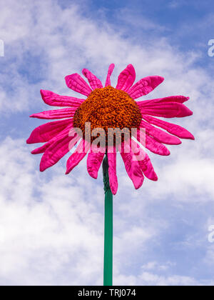 Large fabric flower against blue sky outdoors Stock Photo