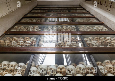 Stack of human skulls at the Choeung Ek Genocide Memorial Stupa at the Killing Fields,  Phnom Penh, Cambodia, Asia Stock Photo