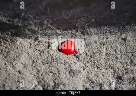 Red heart on concrete background. Valentines day concept Stock Photo