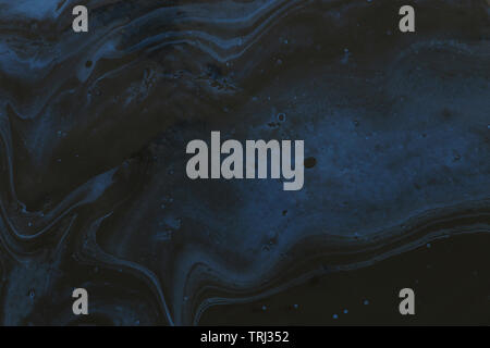 photography of abstract marbleized effect background. Blue and black creative colors Stock Photo