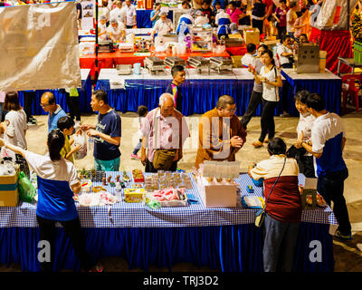 SINGAPORE, 18 MAY 2019 - Devotees and monks browse the Vesak Day night market inside Bright Hill temple (Kong Meng San Phor Kark See). Stock Photo